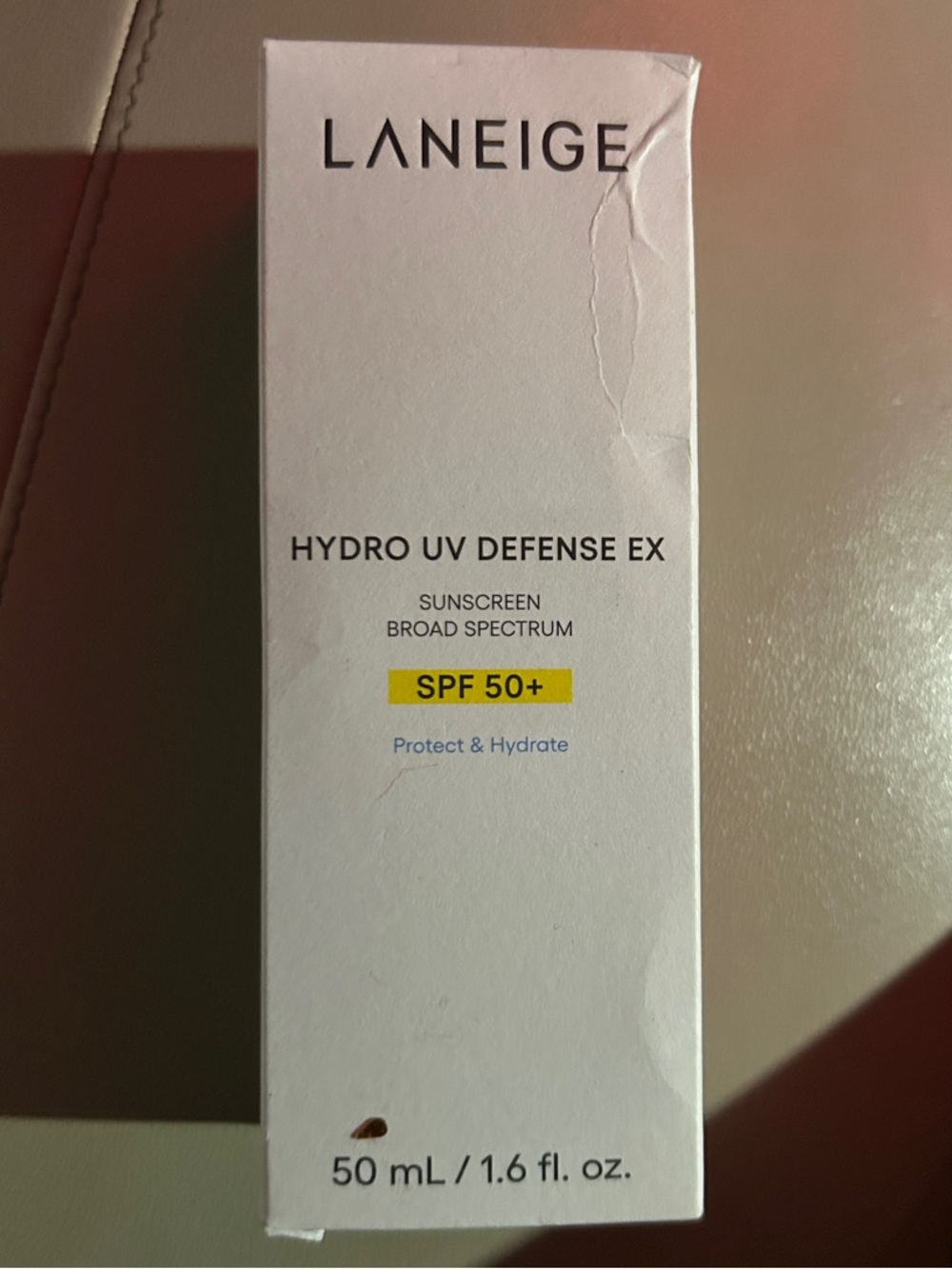 LANEIGE White Sunscreen Box with Subtle Red Accent